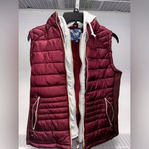 Maroon vest with gray hoodie lining and zipper on inside